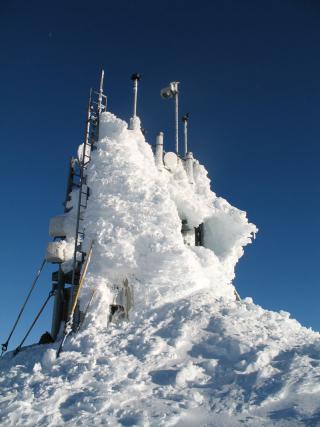 Sheep Mountain tower is one of the mountaintop sites that collects wind and temperature information that is used to decide whether turbulence is present in the area. As can be noted from the rime ice accumulation on the tower, operation and maintenance of the JAWS system is often challenging because of harsh environmental conditions. To better warn pilots of potentially dangerous turbulence, the FAA and Juneau airport officials turned to NCAR's Research Applications Laboratory (RAL) for a solution. RAL scientists had previously designed the software used in the turbulence alerting system developed for Hong Kong's International Airport, which has turbulence issues similar to Juneau's. The FAA asked RAL scientists to create a similar, prototype system for Juneau.